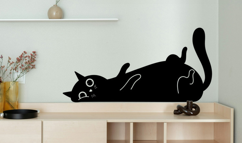 A cat decal on a wall from brighton vinyl signs